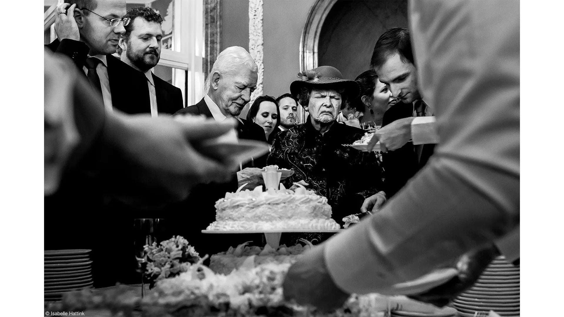 people cutting a cake
