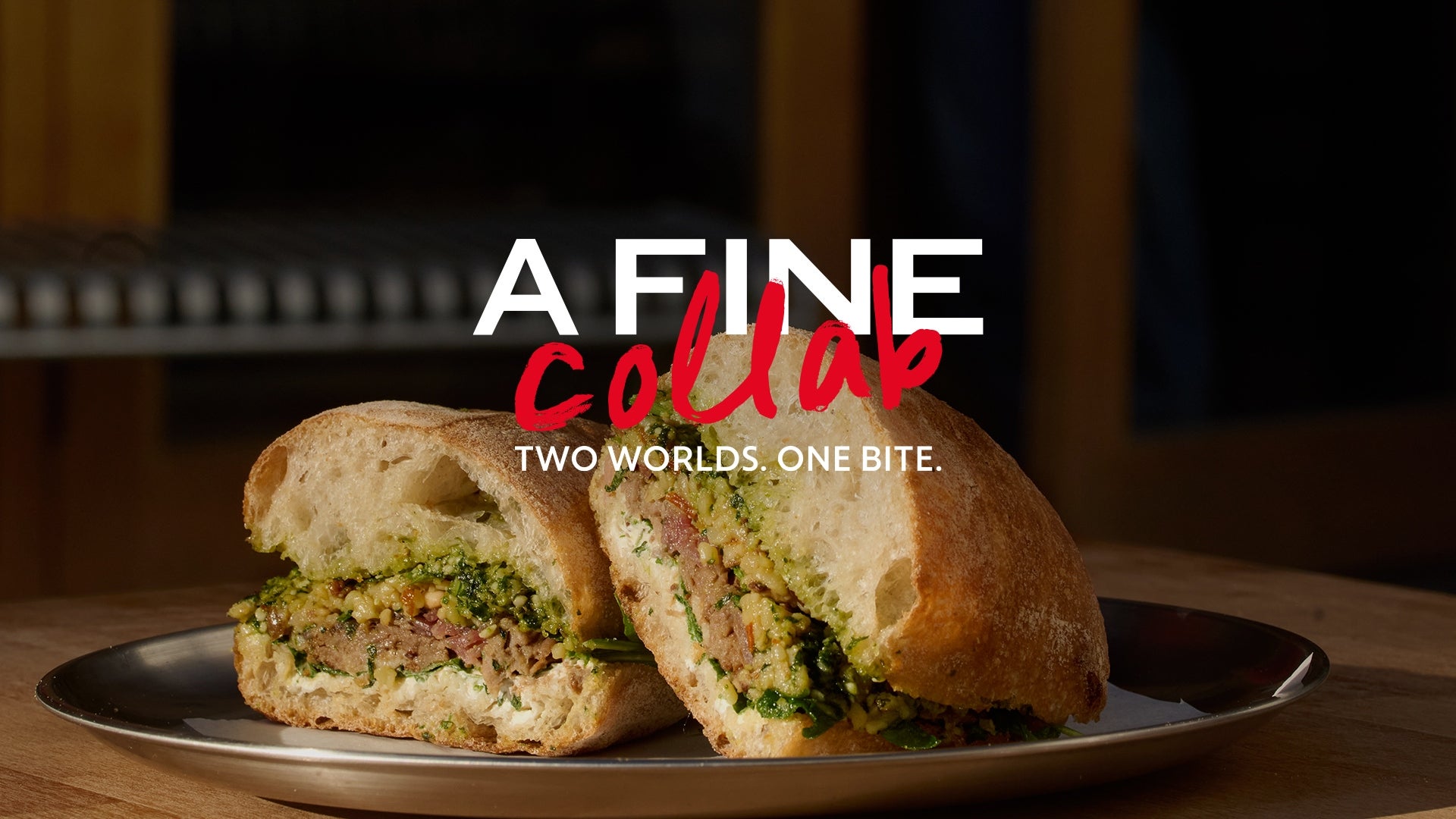 A sandwich on a metal plate for A Fine Collab.