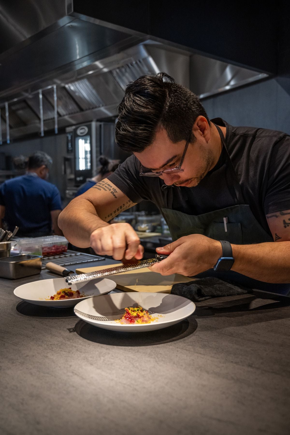 Chef Alberto Landgraf plating at Bossa in London.