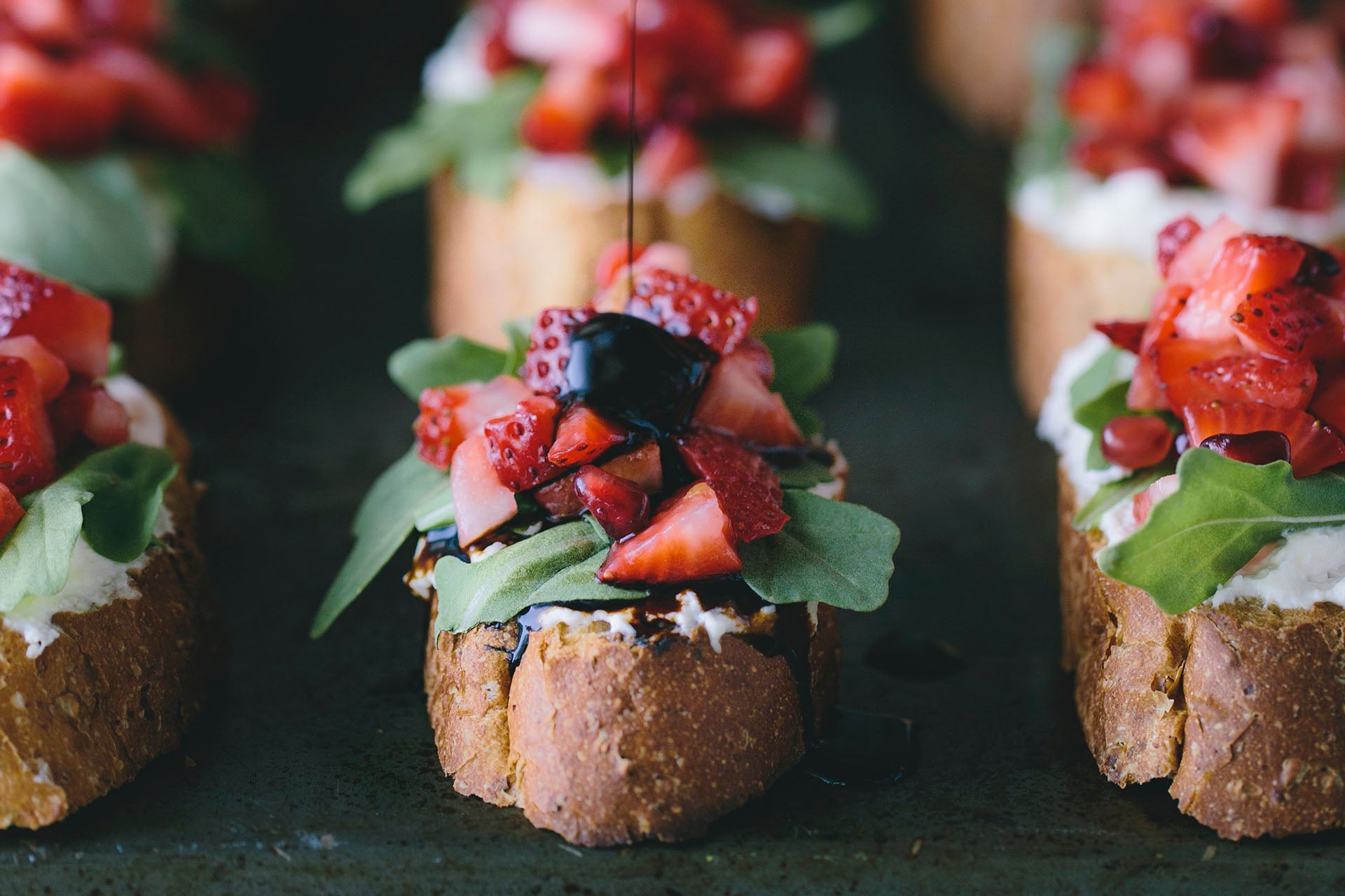Platter of strawberry bruschetta with balsamic reduction.
