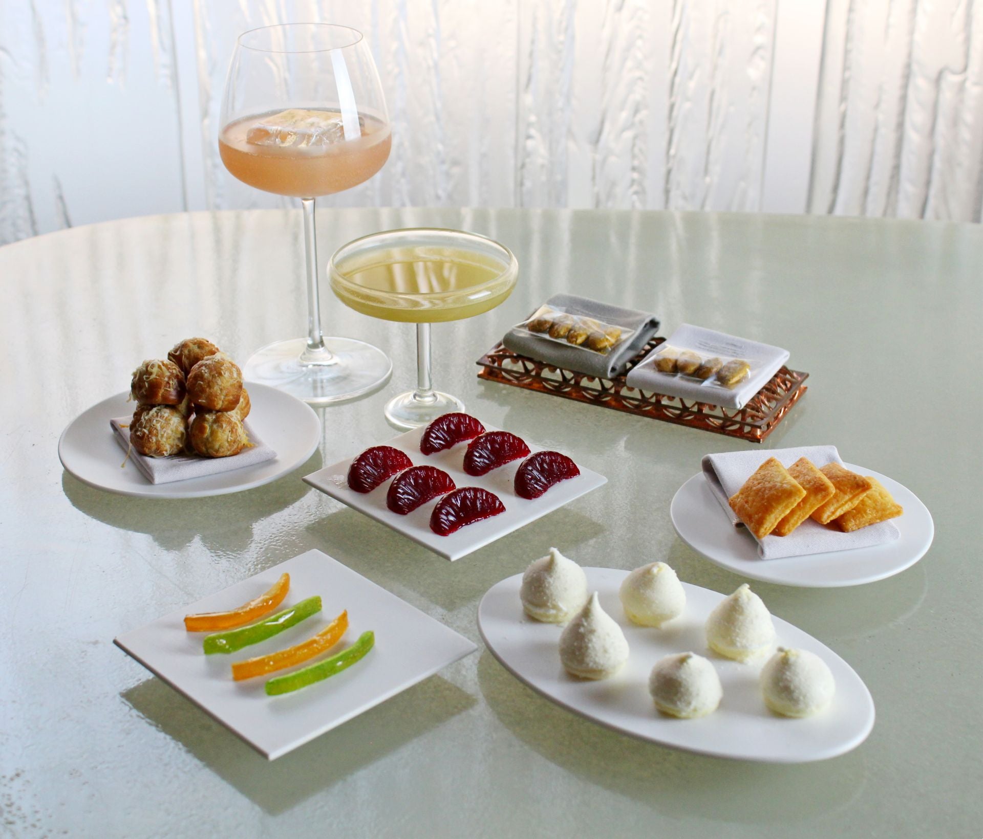 a selection of cocktails and snacks at Enigma