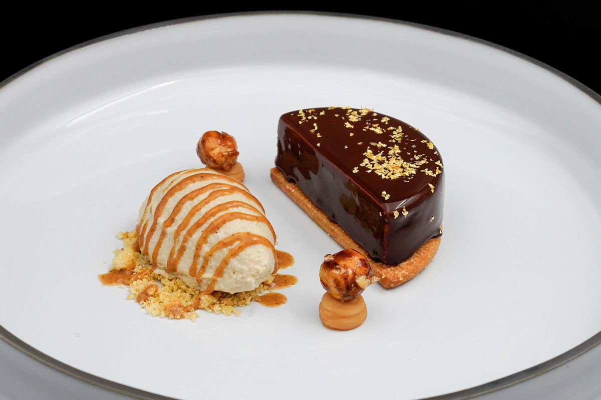 Chocolate cream with a salted caramel insert, caramelized hazelnuts, and hazelnut ice cream