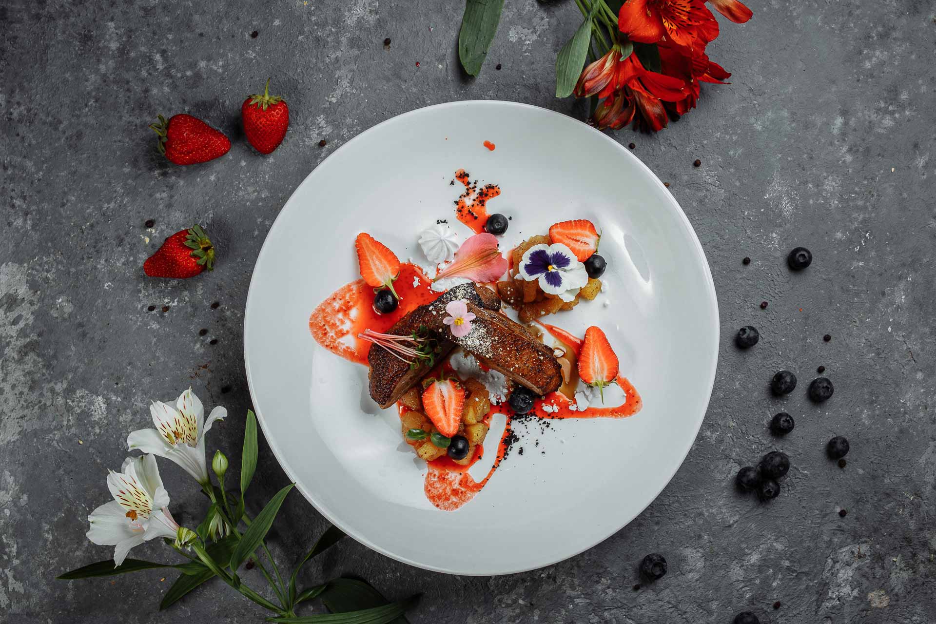 Contemporary dish of duck with strawberries.