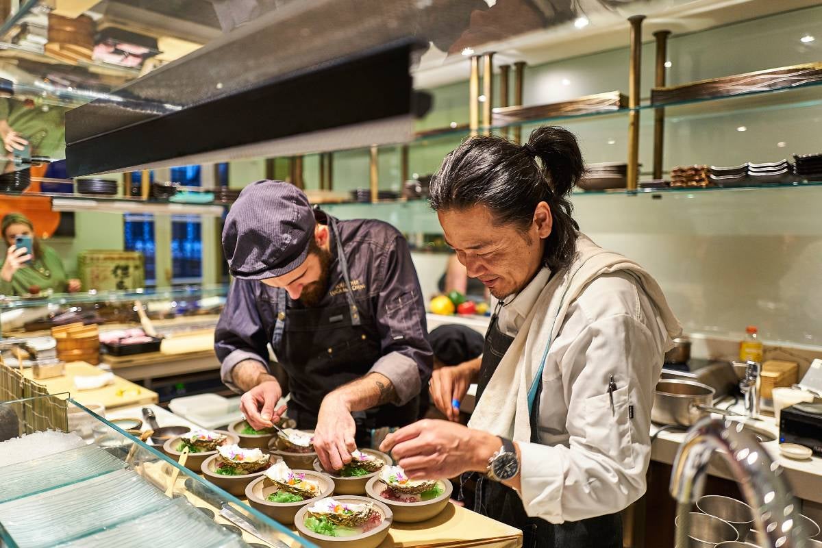 Chef Masaki Sugisaki preparing a dish using koji.
