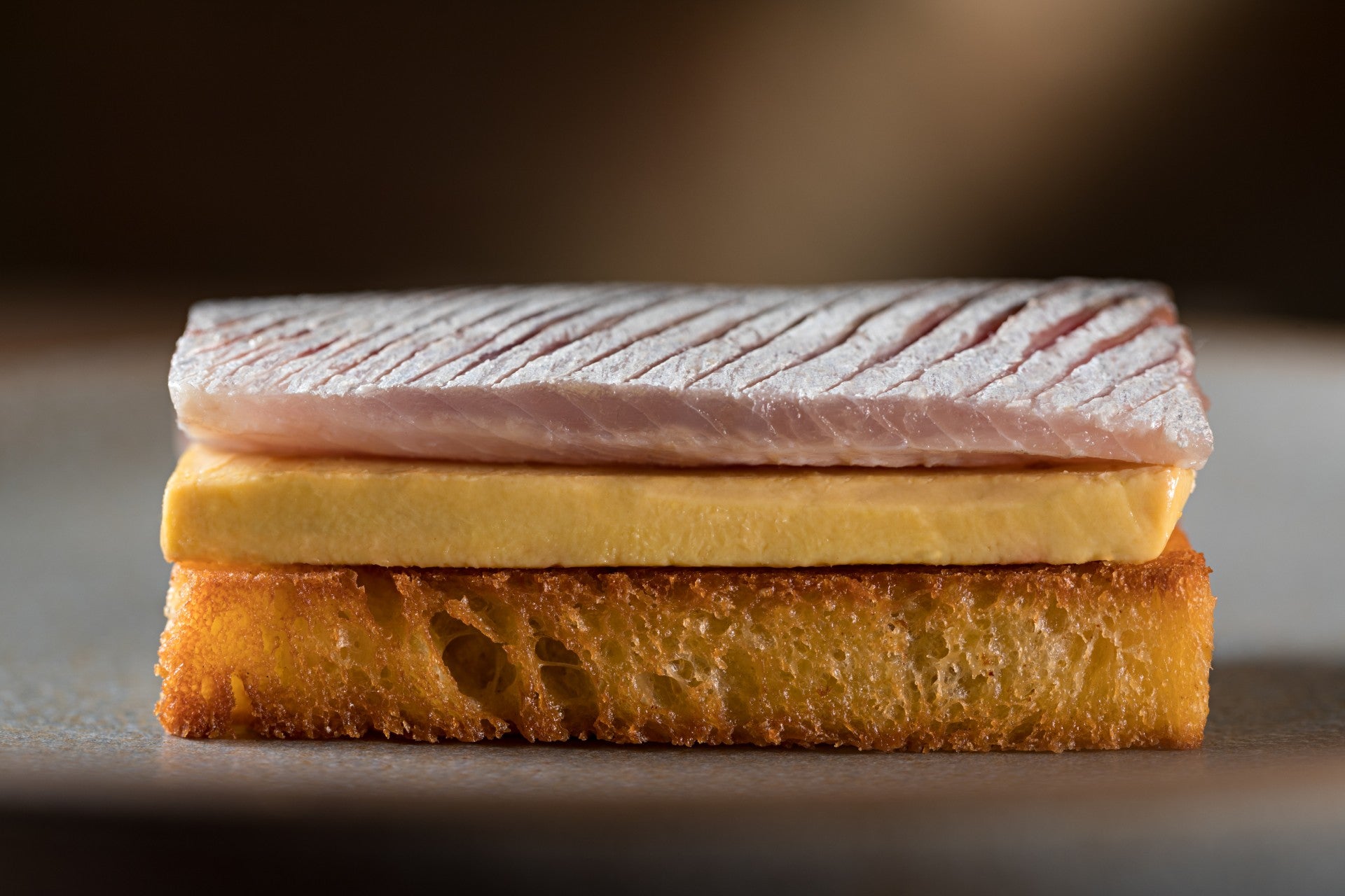 Pickled sardine, raw foie gras, brioche at Oteque.