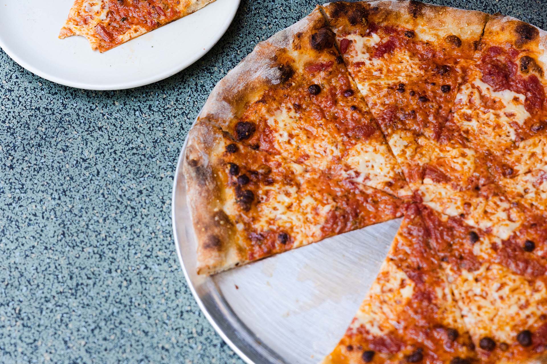 Close up on a pizza missing a slice