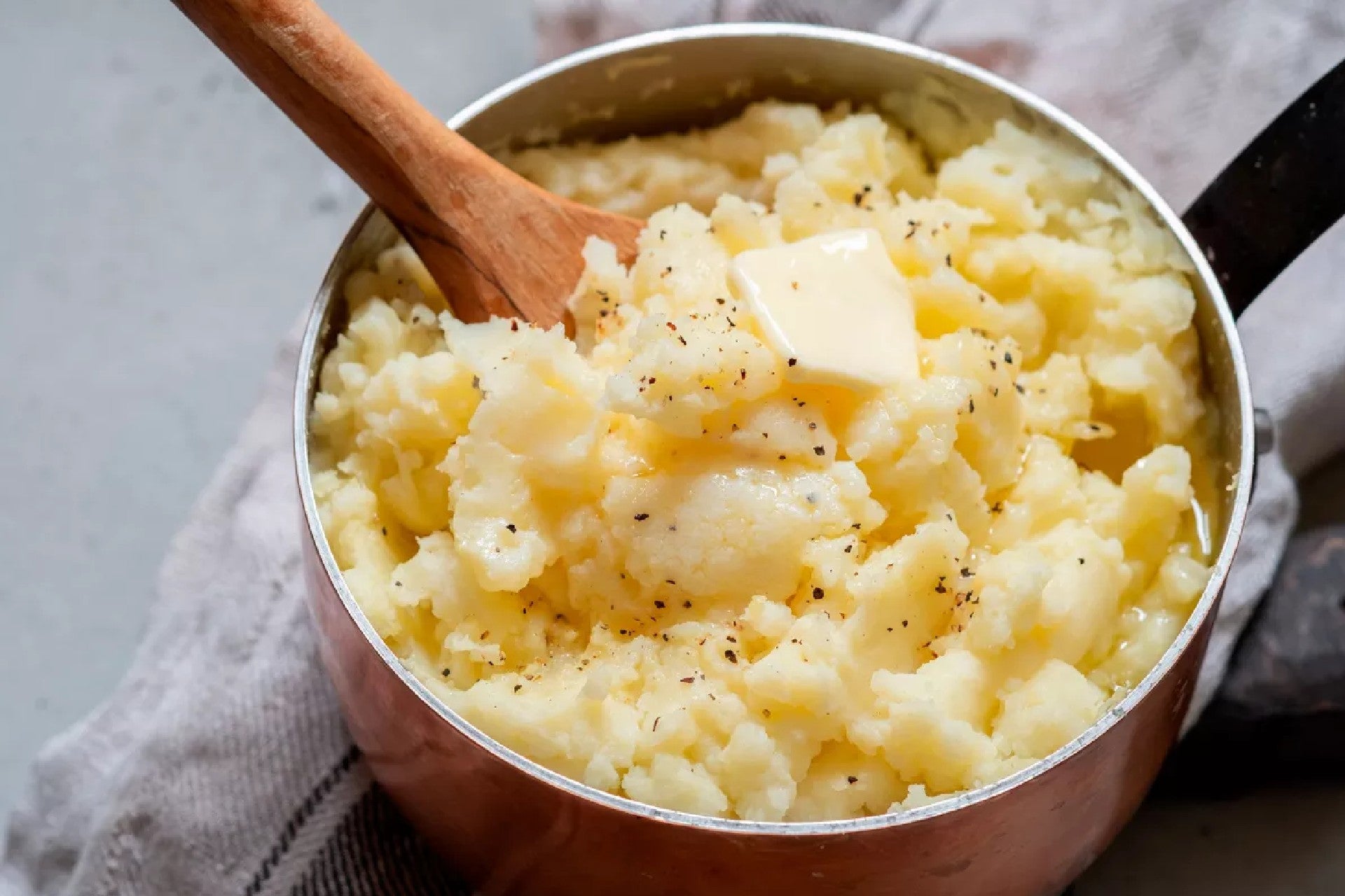 Mashed potatoes in a pot with butter