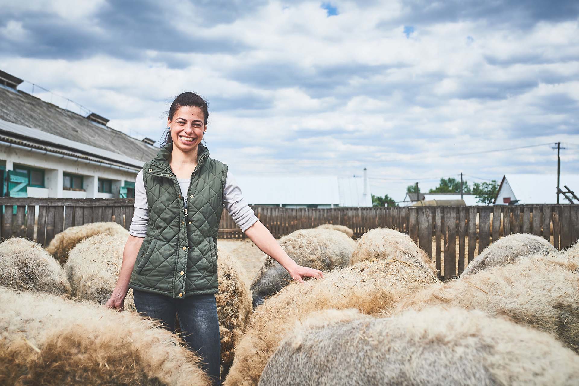 Zsoka Fekete posing with her pigs