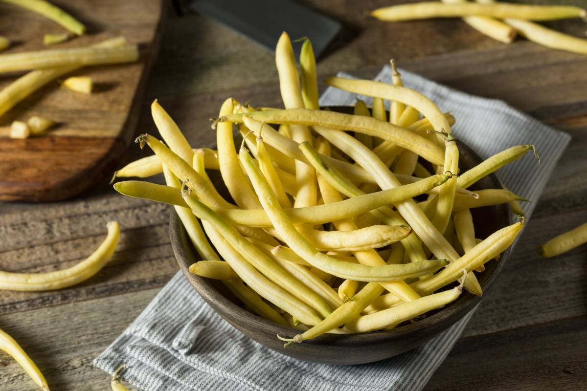 Bowl full of Yellow wax beans, a variety of green beans, known as yellow beans or butter beans