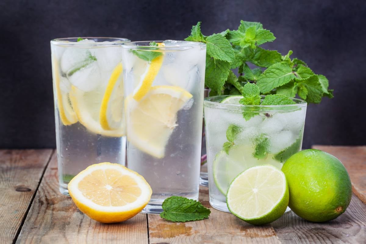 Two glass with rum and fresh lime or lemon, the simplest option as mixers