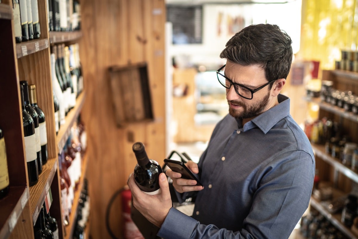Wine collector buying a wine bottle using app