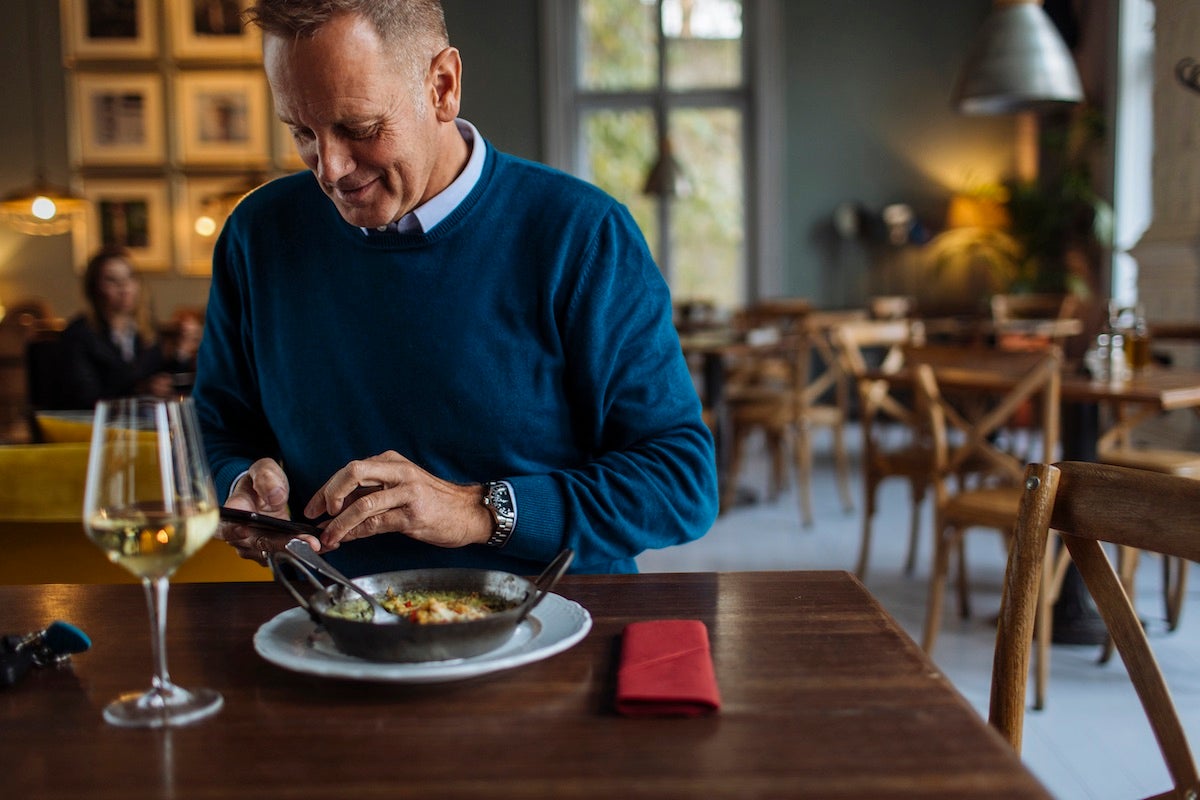 Man enjoying meal outside peak service time