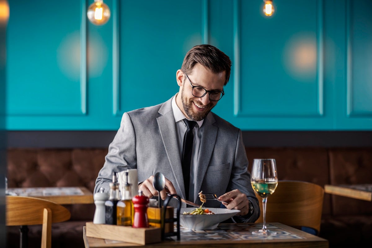 Business man enjoying alone lunch experience