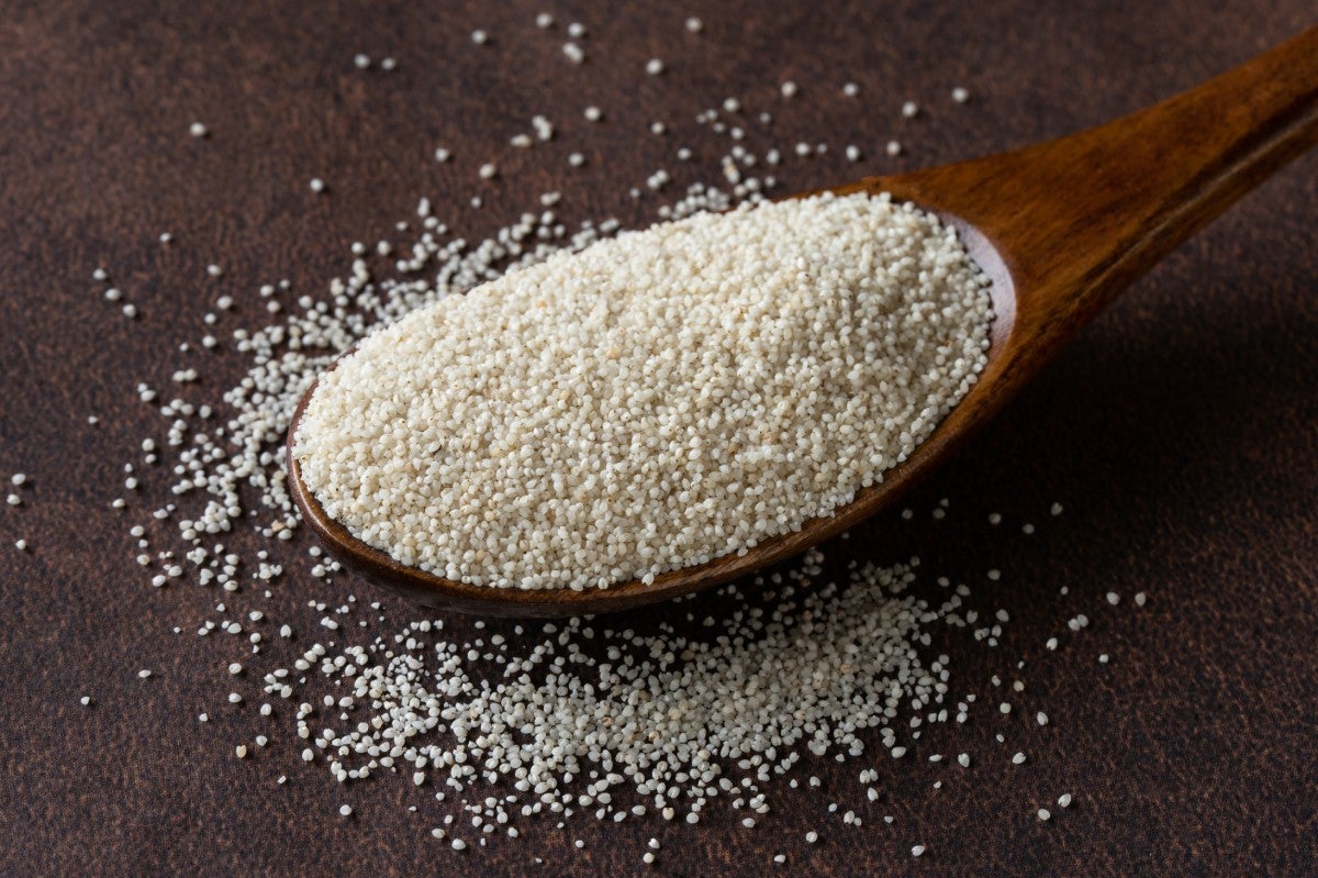 A spoon full of seeds of fonio millet also known as findi or acha