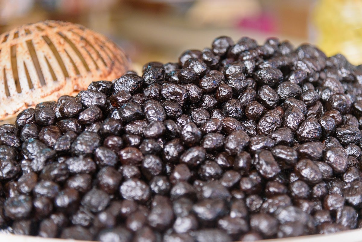 Market bowl fill with Beldi black olives grown in Morocco