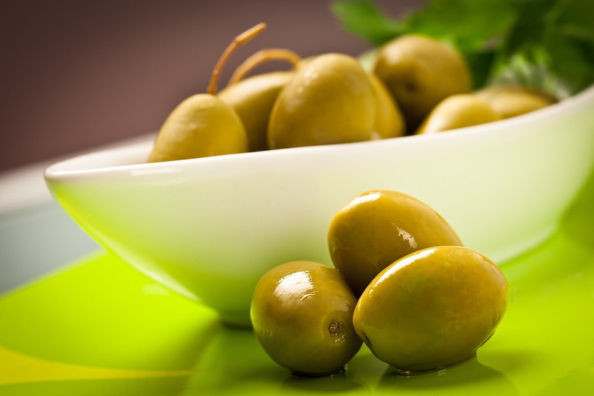 Bowl of large-size green Cerignola olives from south of Italy
