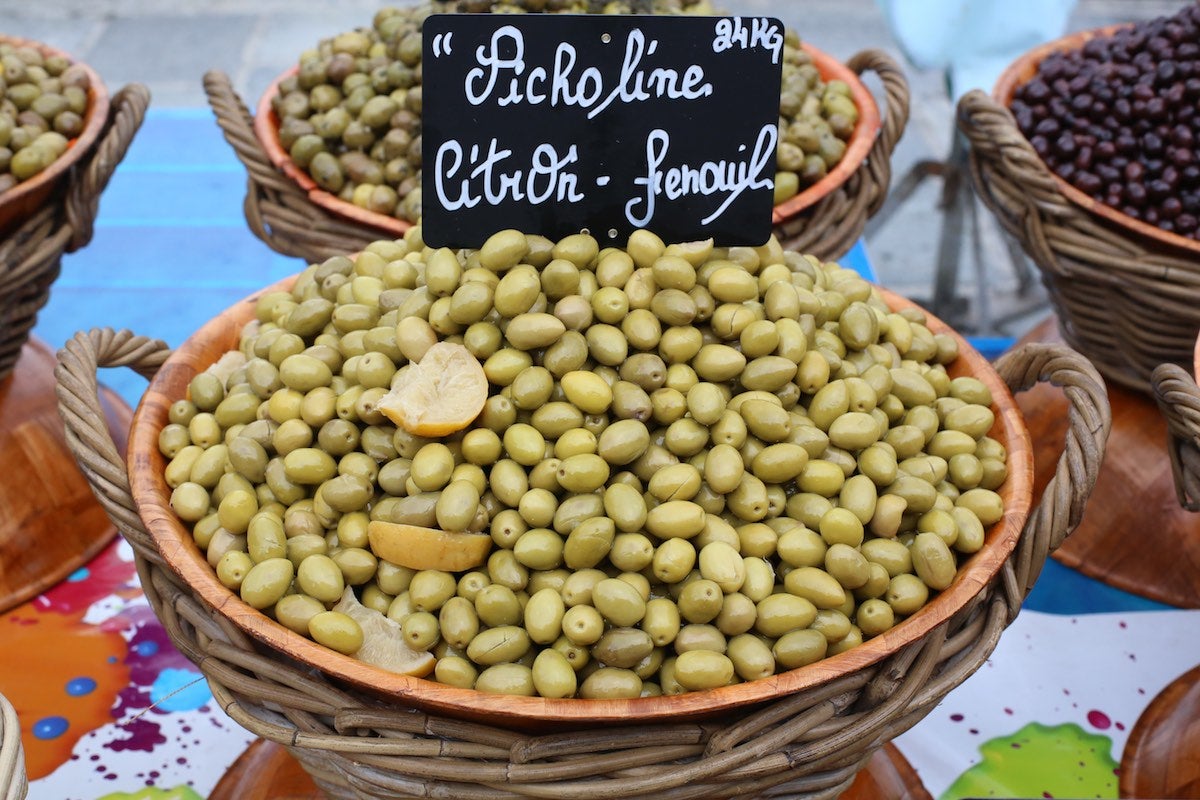 Market bowl fill with Picholine olives grown in Morocco