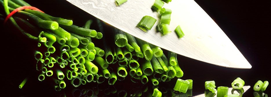 Sharped knife cutting vegetables