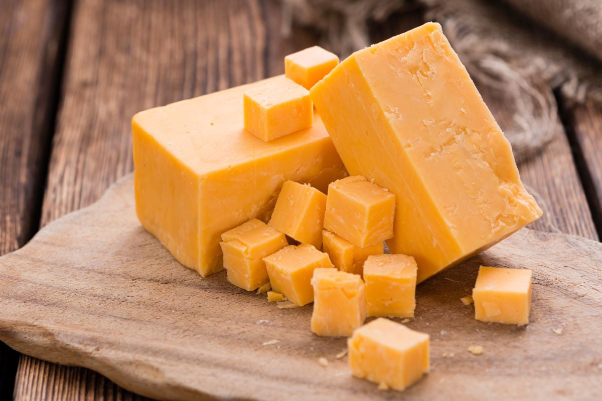 A piece of traditional English Cheddar cheese from the village of Cheddar in Somerset