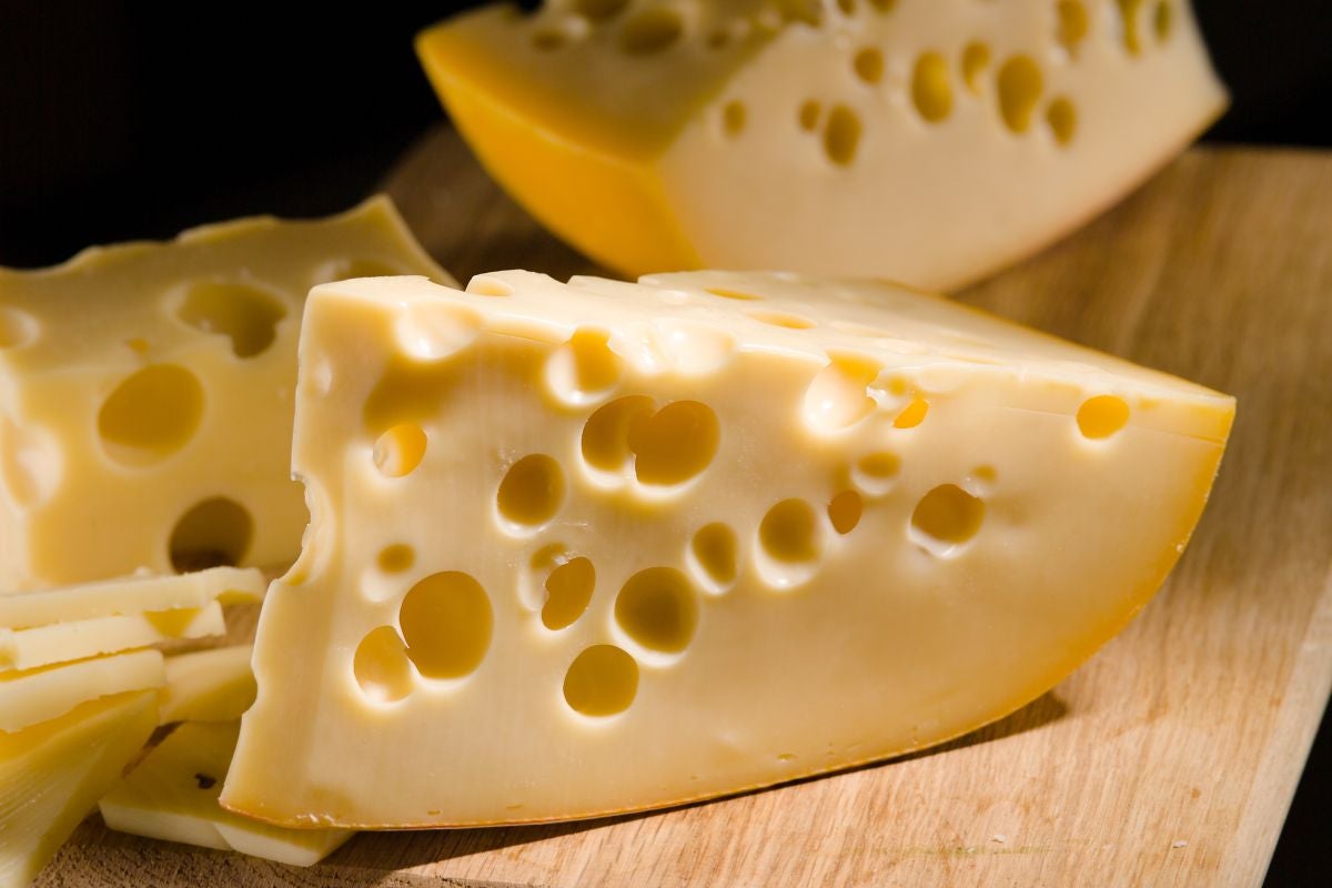 Pieces of solid cheese originated from Switzerland