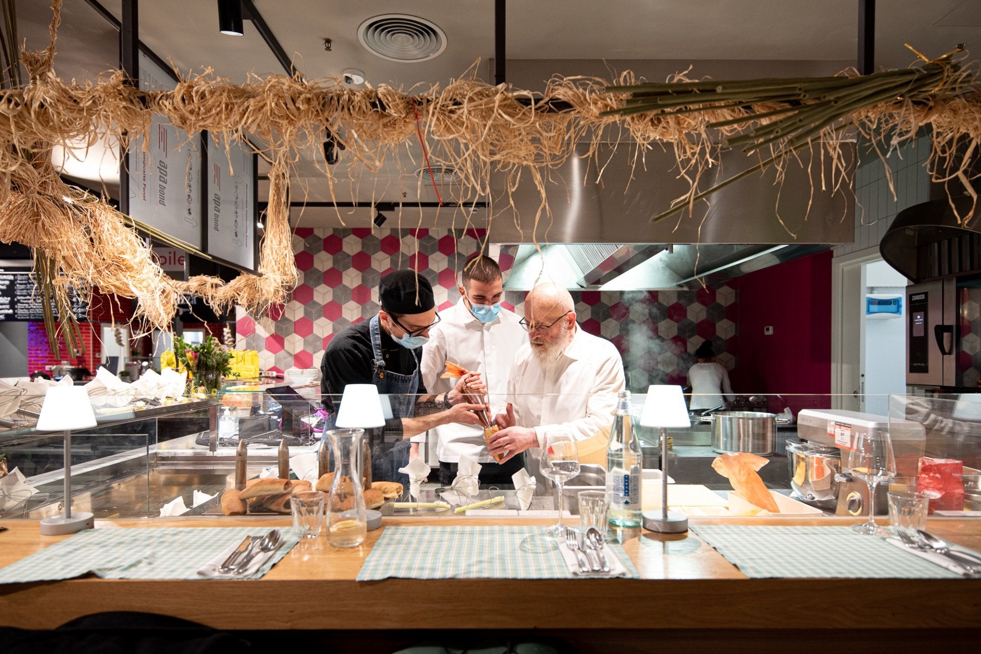 A chef cooking at the Trattoria Vegetale at Turin market
