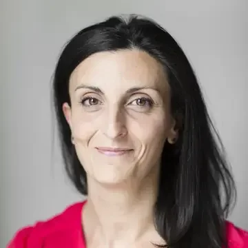 Food journalist Elide Achille in a red blouse.