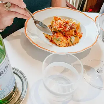 Enjoying paccheri with sea bass at Langosteria.