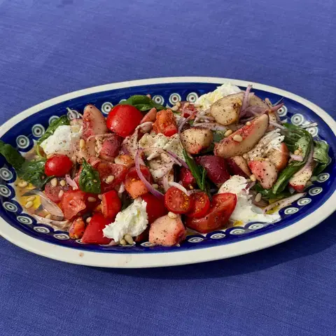 Tomato summer salad by Jordon Ezra King.