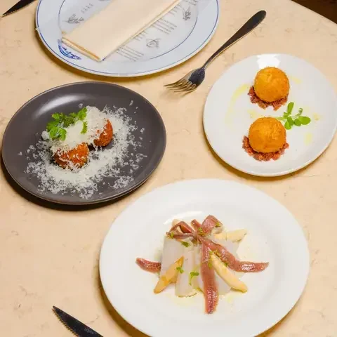 Dishes at Sabor, including croquetas.