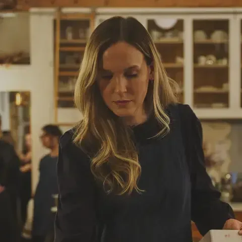 Creator Anna Laverty setting a table.