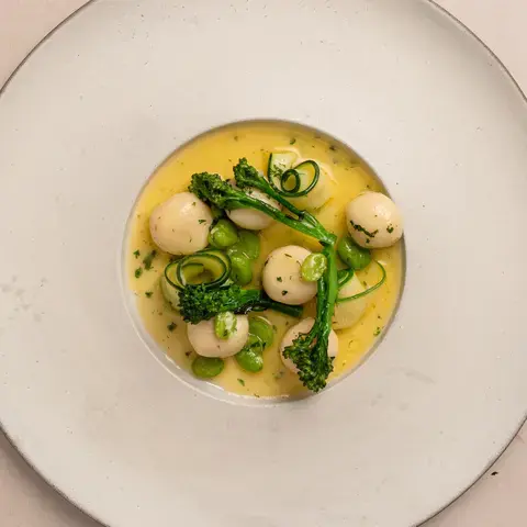 Gnudi with spring vegetables and lemon butter sauce by Stuart Ralston.