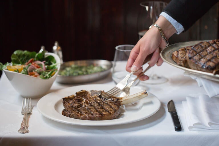Steak being served at The Guinea Grill.