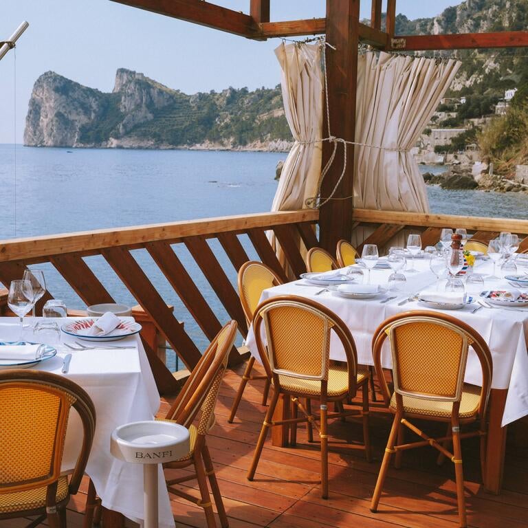 Tables on the terrace at Lo Scoglio.