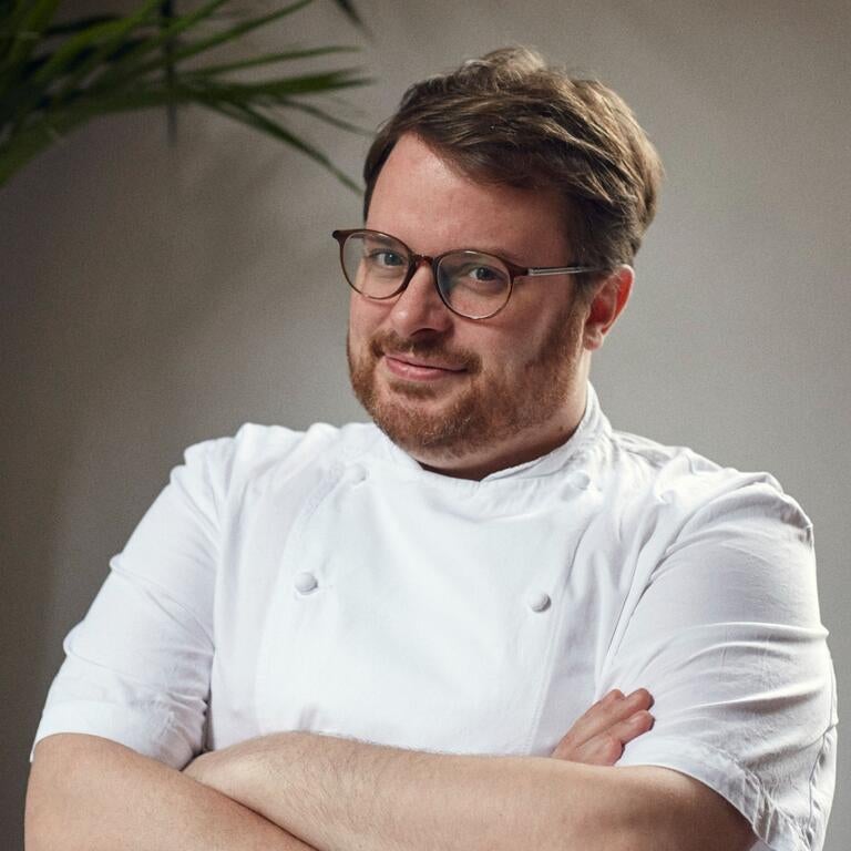 Chef Isaac McHale with his arms folded.