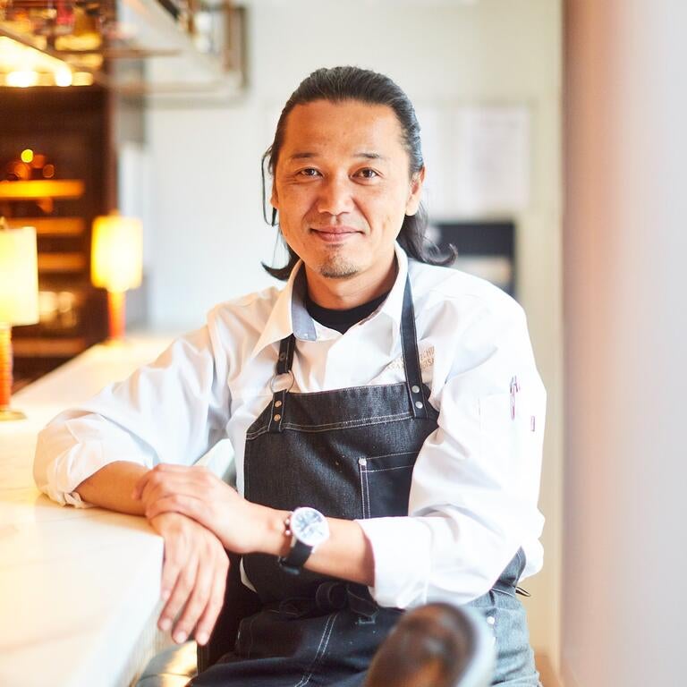 Chef Masaki Sugisaki seated at the the bar at Dinings SW3.