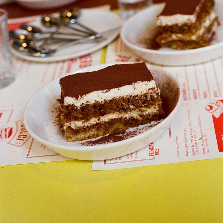 Tiramisu on a restaurant table.