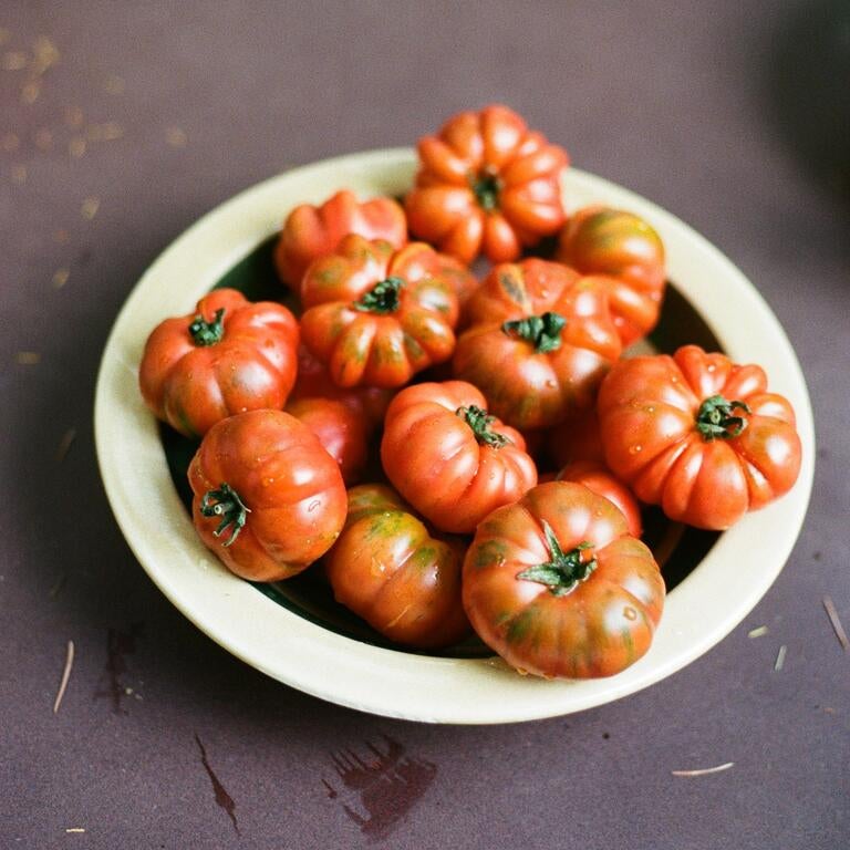 A bowl of red tomatoes.
