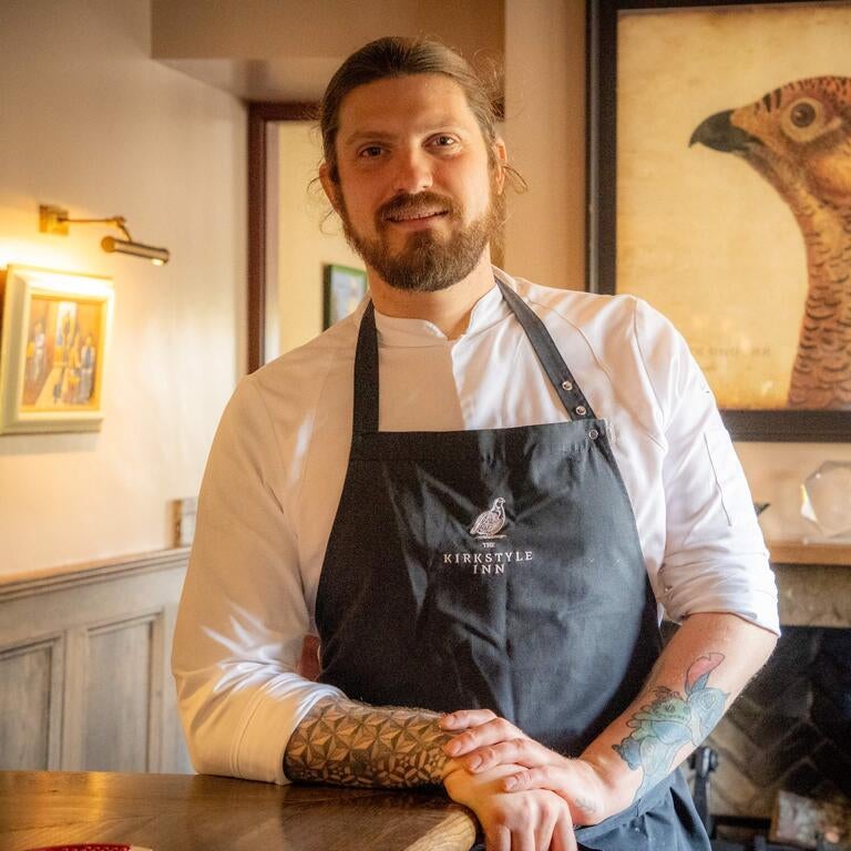 Chef Connor Wilson in an apron.