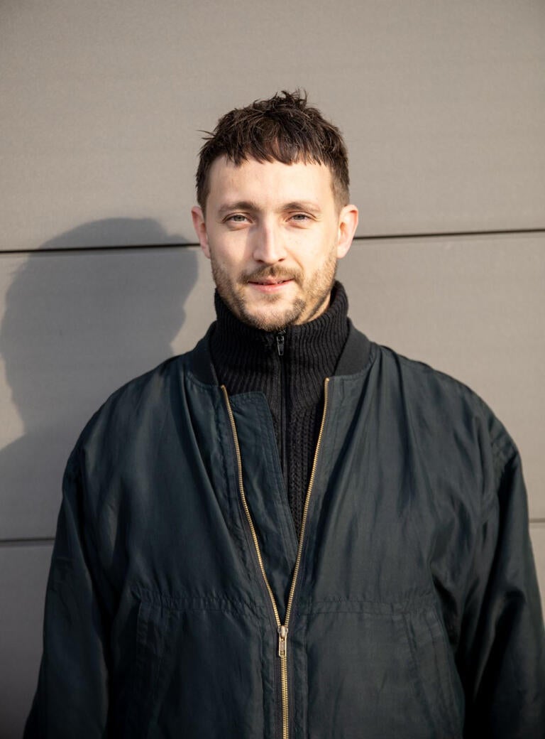 Chef Joe Otway in a black bomber jacket.