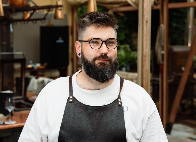 Chef Ben Chamberlain in a dark apron.