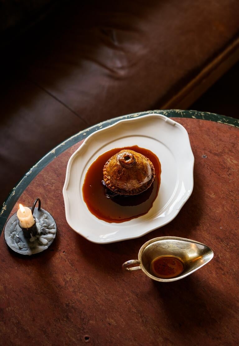 A dish and gravy boat on a table at The Mason's Arms.