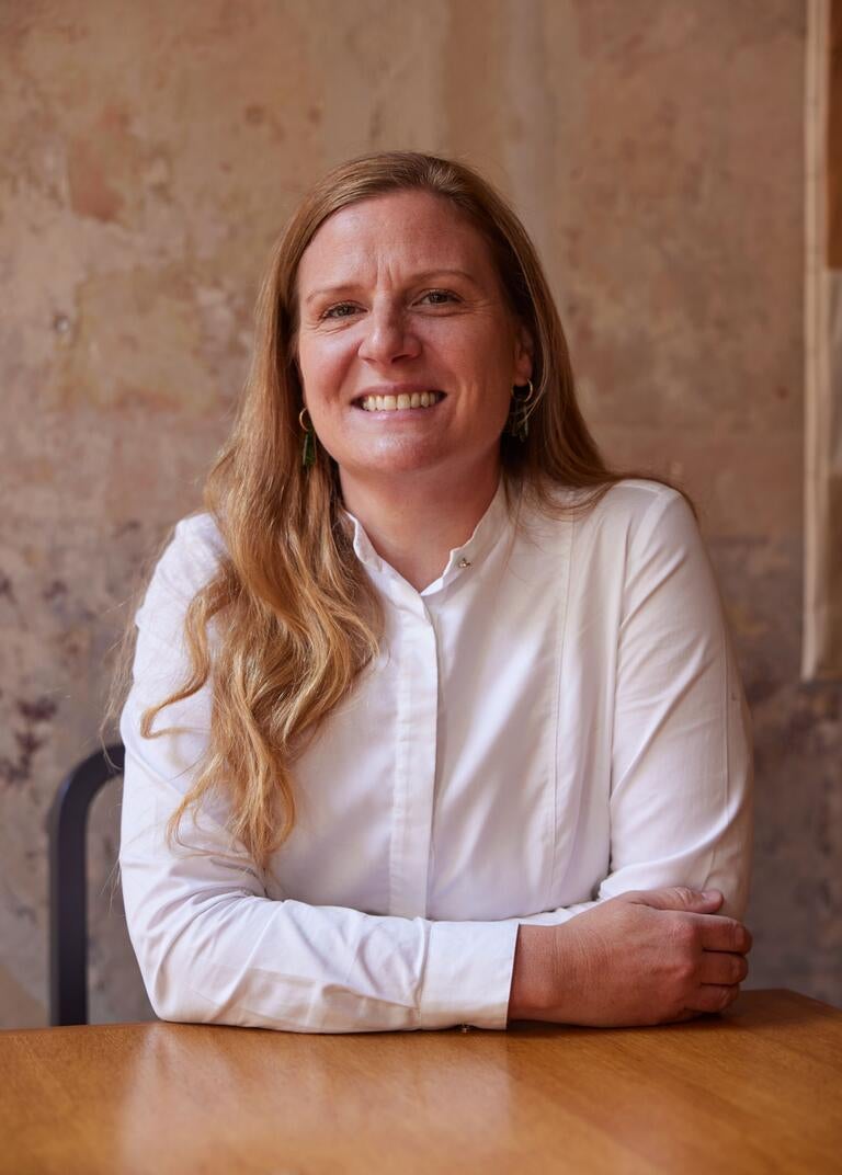 Chef Chantelle Nicholson in a white shirt, smiling.