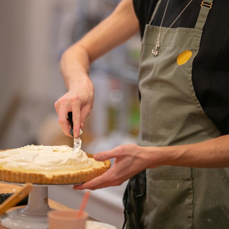 A person making a tart at Quince in London.