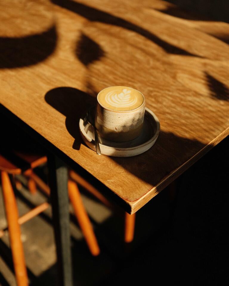 Cup of coffee on a table at Coffi in Liverpool.