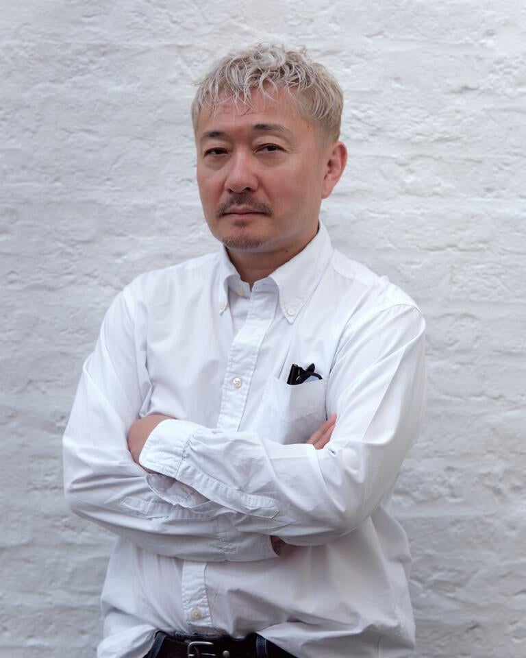 Chef Endo Kazutoshi in a white shirt.