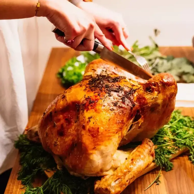A Christmas turkey being carved.
