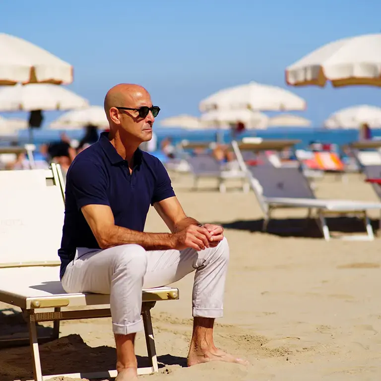 Stanley Tucci on the beach in Italy.