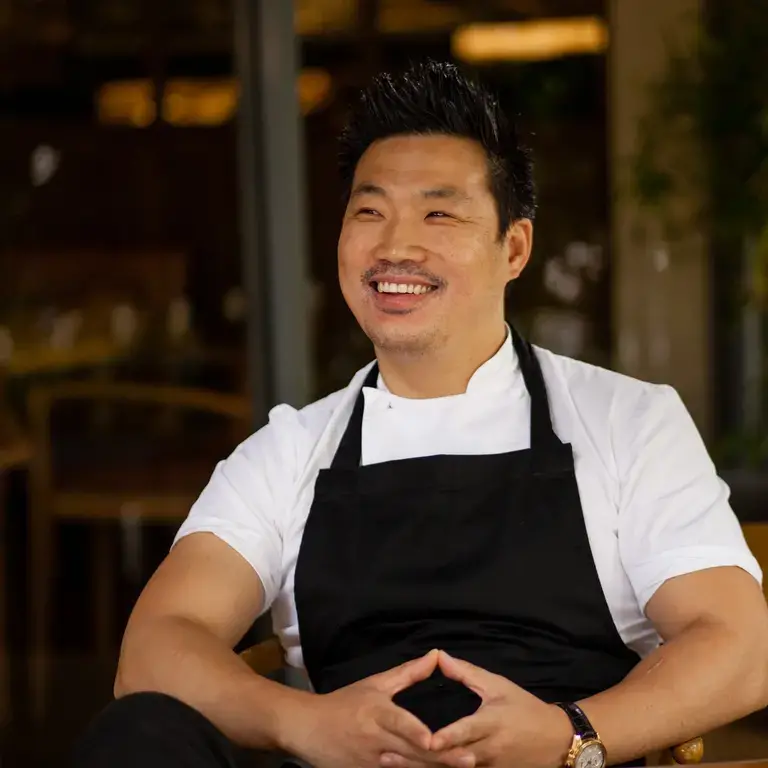 Chef Andrew Wong, smiling and relaxed.