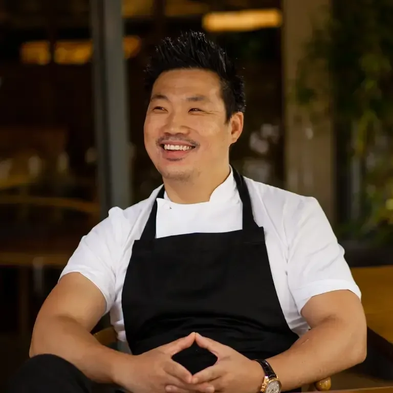 Chef Andrew Wong, smiling.