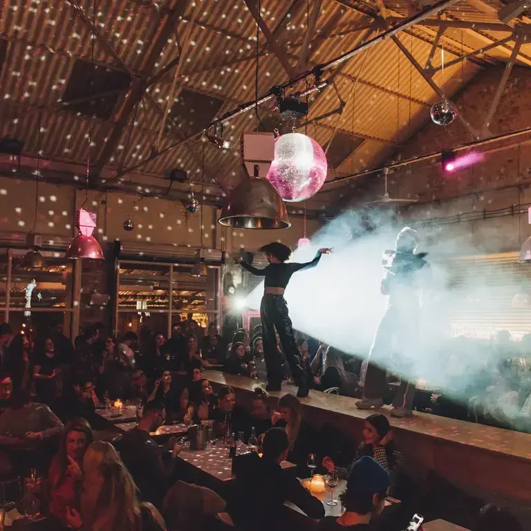 Performers on the central runway at Firehouse in Manchester.